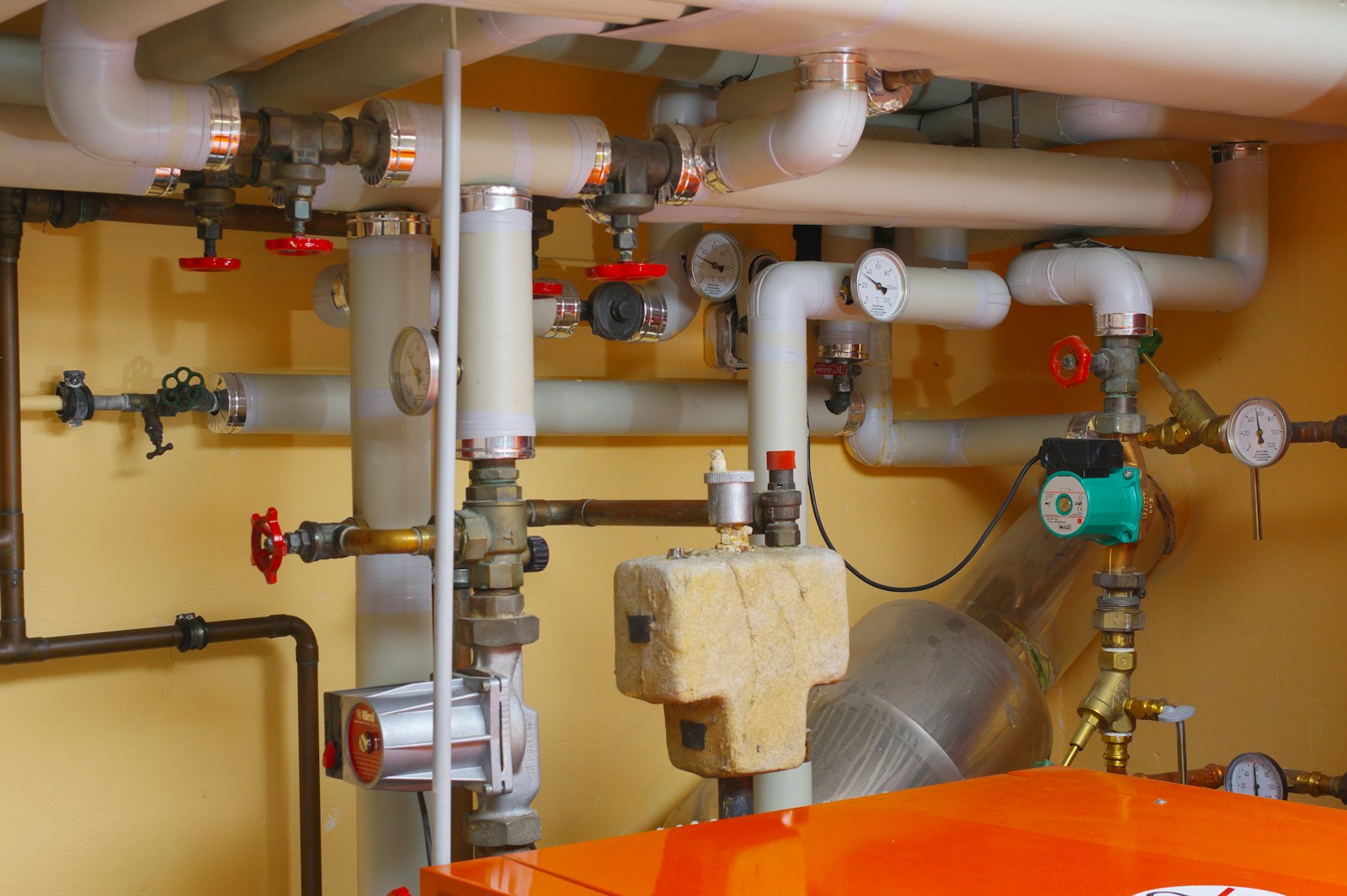 Mechanical room with pipes, valves and gauges